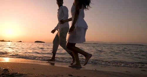 Romantic Couple Dancing on Beach at Sunset