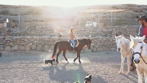 Young People Riding Horses Inside Corral - Wild Couple Having Fun In