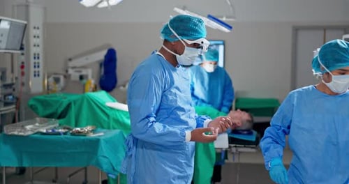 Surgeon mask, gloves and nurse help with dressing, preparation and getting ready in operation