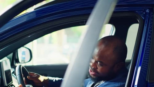 Client Doing Thorough Car Test Drive Making Sure He Feels Comfortable