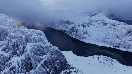 A Stunning Bird'seye View Showcases High Mountain Rocky Peaks Blanketed with White Snow The