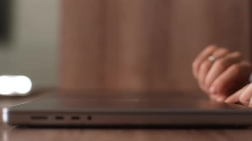 Woman Opens Laptop and Begins Typing Close Up