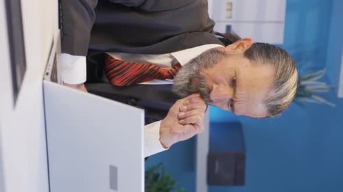 Man Examining Computer Closely in Modern Office