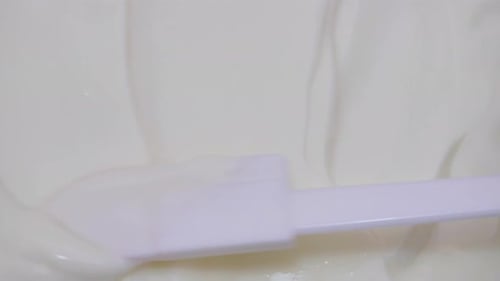 Shooting of Bowl with Stirred Yoghurt and Spoon