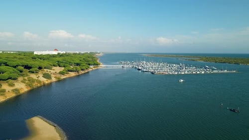 Drone flying over Piedras River towards Puerto Marina El Rompido
