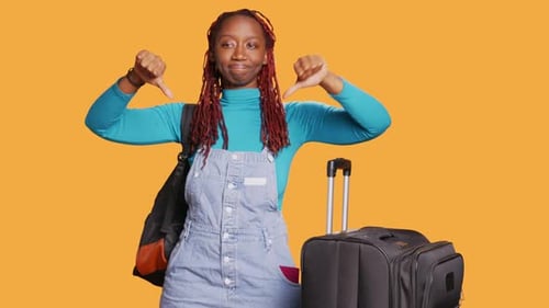 Young Woman Expressing Disapproval Thumbs Down