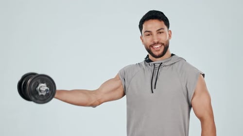 Man Bicep Curls with Dumbbell on Plain Background