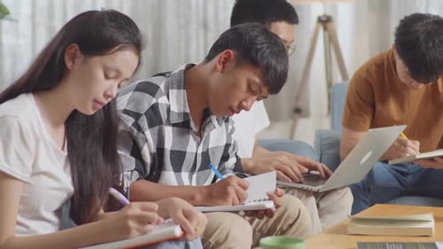 Young Adults Studying Together Inside a Home