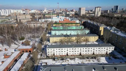 Drone Shot of a Residential Suburban Area Covered in Snow During a Winter Day