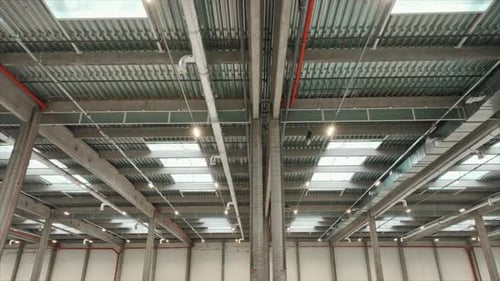 Horizontal Shooting of Ceilings of Spacious Expansive Warehouse Interior Empty Warehouse in Logistic