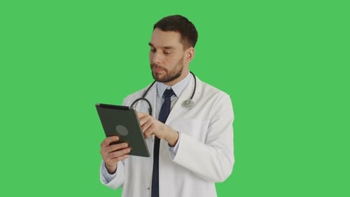 Smiling Doctor Using Tablet on Green Screen