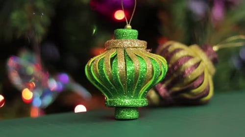 Glitter foami christmas ornaments, on a green cutting mat. Beautiful Xmas decorations.