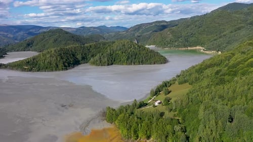 Flying above decanting lake, toxic residual drainage waters from copper mine aerial