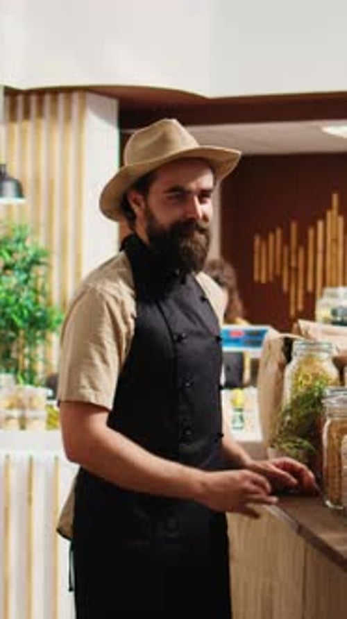 Vertical Video Bio Shop Vendor Adding Pantry Staples