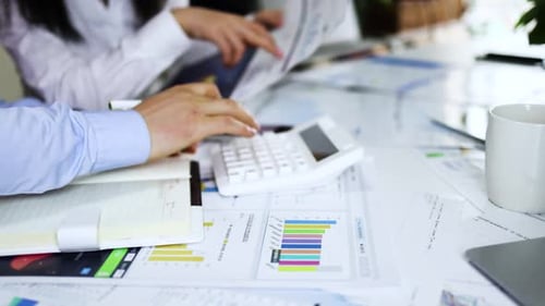Analyzing business finance data strategy and calculations in a meeting