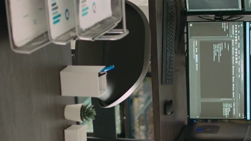 Vertical Video Computer Monitors Showing Parsing Code in Empty It Agency Office