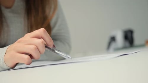 Close-up: woman lawyer office worker proofreading a contract before signing