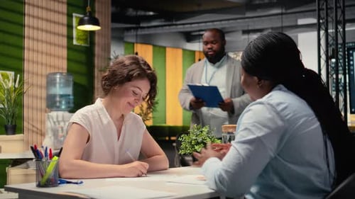 Professional Candidate Fills Out Onboarding Documents and Signs Contract Terms