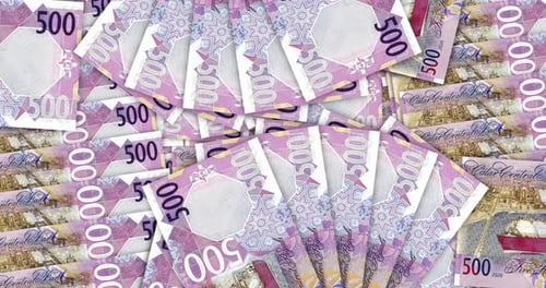 Qatar Riyal money banknote pile packs