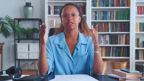 Young Adult Woman Communicating at Desk