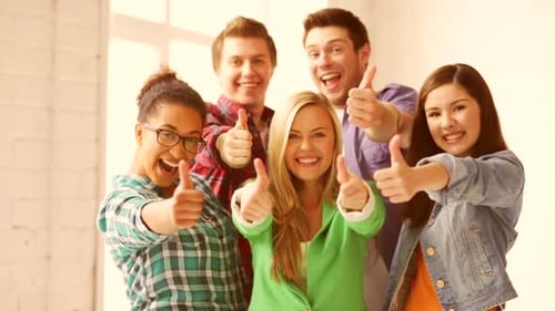 Education and School - Happy Students Showing Thumbs Up Achievement