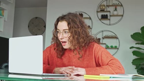Woman Working from Home Reacts to Good News