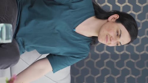 Woman Experiencing Pain at Home