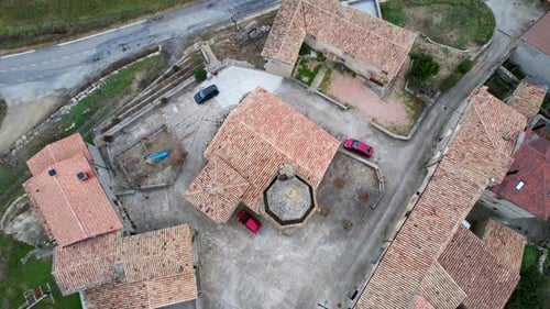 Panoramic drone view of old medieval traditional style stone houses and tile roofs of houses