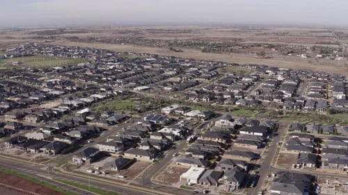 Aerial drone view of newly built suburban houses, housing neighbourhood located outside of Melbourne