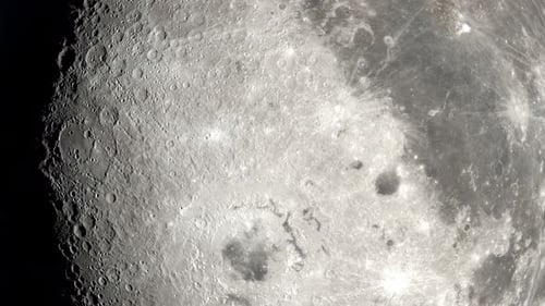 A 4K close-up of the lunar surface in rotation.