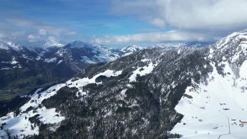 Profile view of Fronalpstock mountain ranges during morning in Glarus, Switzerland. Drone shot.