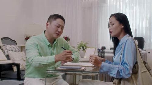 Manager Talking to Female Client about Spa Salon Services