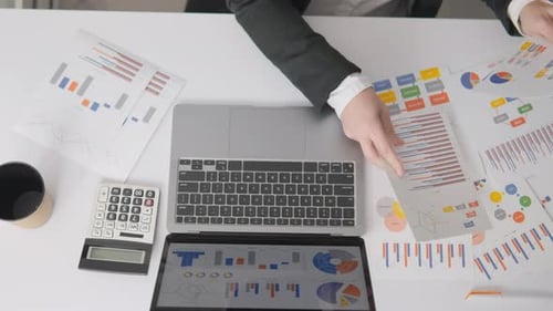 Analyzing Data and Charts in a Modern Office