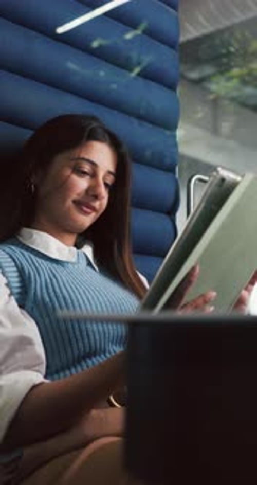 Tablet, happy and woman in office cubicle for online research, article review and editing report