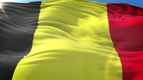 Realistic Belgium Flag Waving in Wind Against Blue Sky