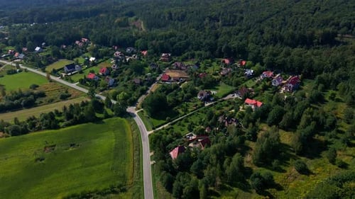 Mountain Village and Road with Moving Cars Aerial View