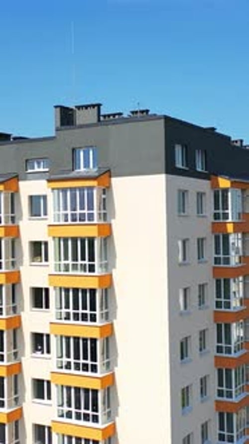 Street of modern residential district. Exterior of new high-rise multi story apartment building