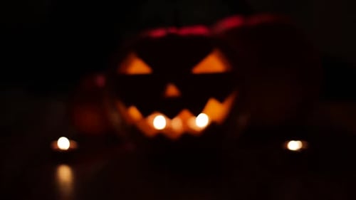 Halloween Pumpkin with Scary Face and Candles