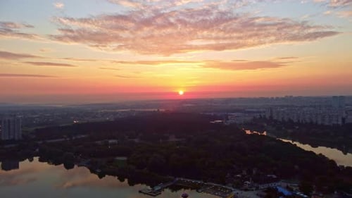 Sunrise on river with beach recreation area