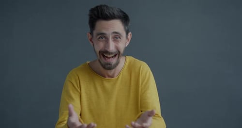 Man Reacts to Something with Shock and Surprise