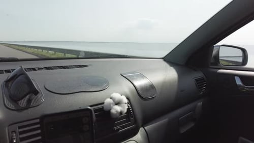 Crossing the river by the bridge inside car POV