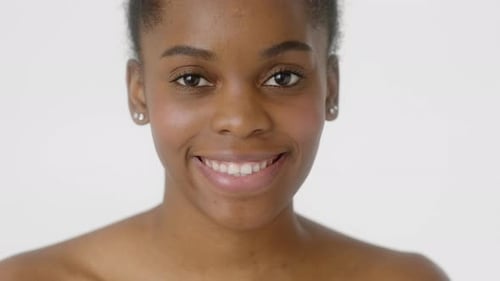 Smiling Woman Posing on White Background Close Up