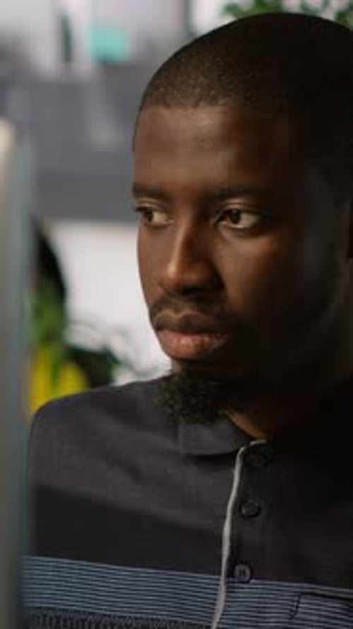 Young Man Working in an Office Environment