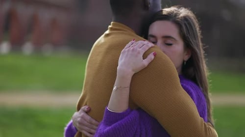 Interracial kiss and hug. Black man with while girlfriend kissing and embrace. love and affection