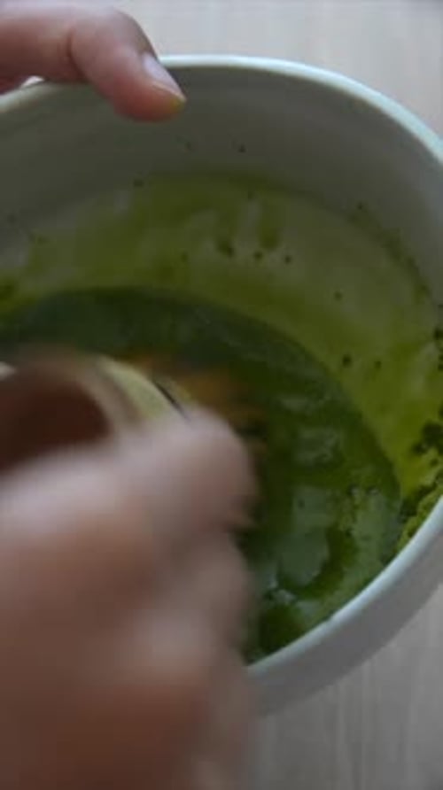 The Art of Whisking Green Tea in a Beautiful and Traditional Bowl for a Perfect Experience