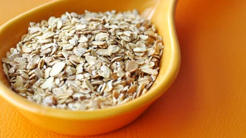Roasted Oats Flakes Spilling on Table