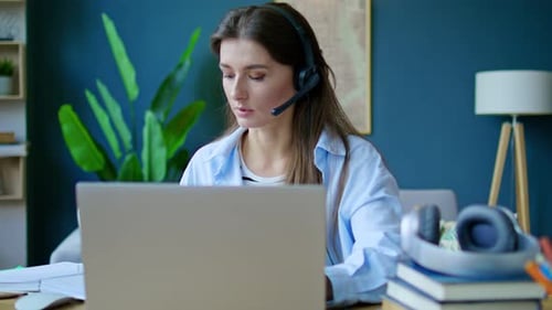 Woman Working at Laptop in Home Office