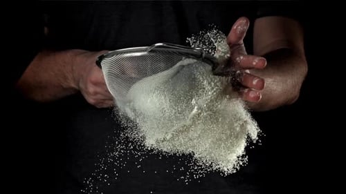 The Cook Sifts the Flour Filmed on a Highspeed Camera at 1000 Fps