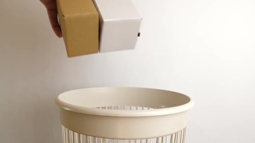 17, Cardboard boxes are recycled and thrown into the trash. The concept of disposal and recycling of