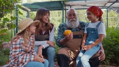 Happy family in a vegetable garden